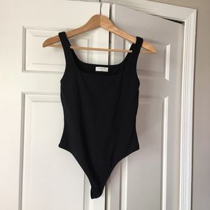 Black bodysuit NWT from Aritzia. Size medium.